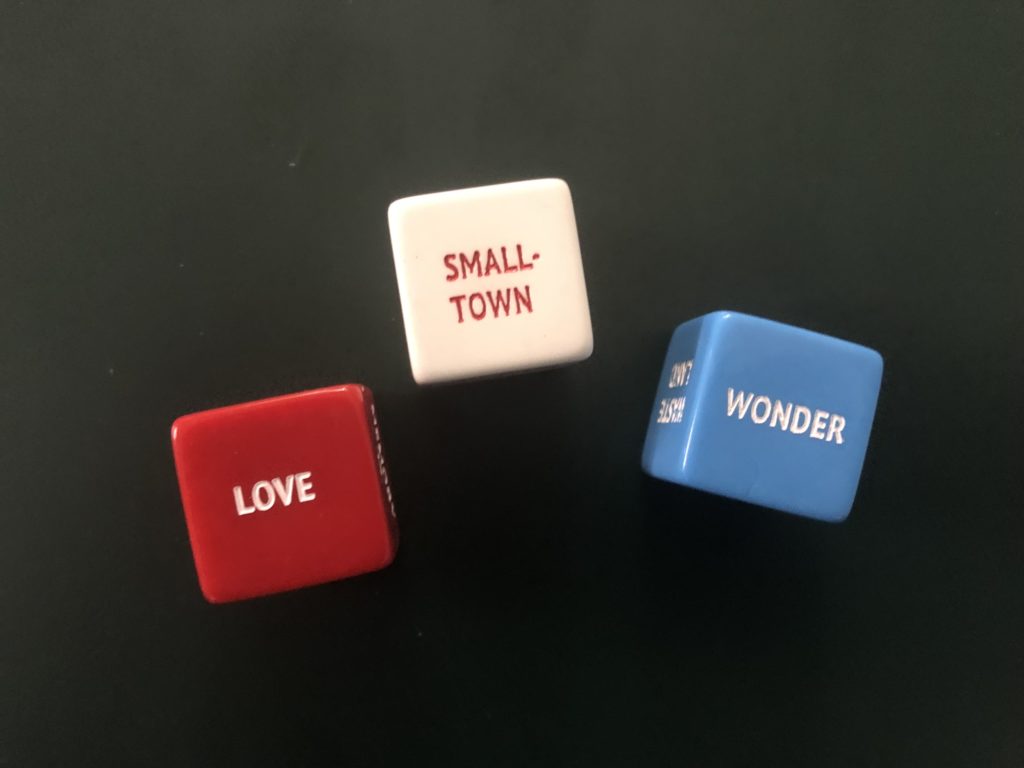 3 dice spelling out love is a small town wonder